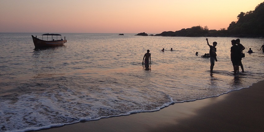 Nirvana Beach boasts a long stretch of sand and pristine waves at sunset, with a secluded environment.