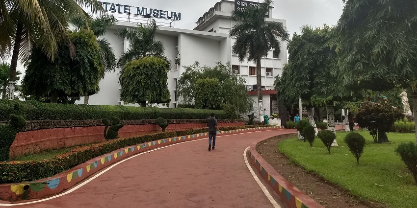 A pathway leading to the Odisha State Museum, showcasing the blend of nature and culture.