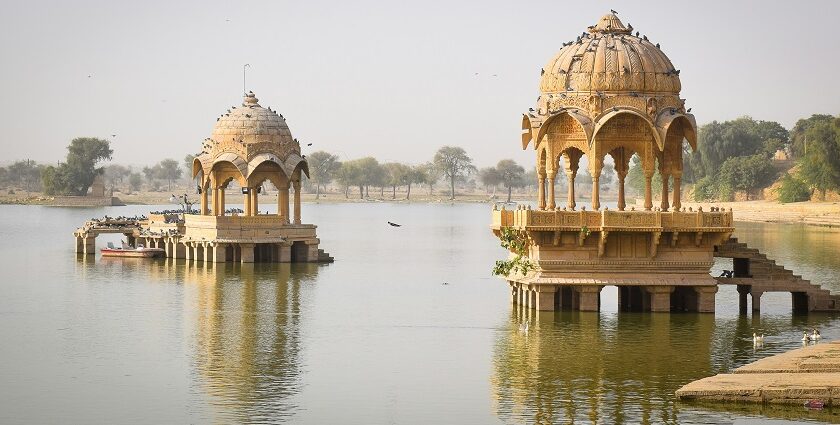 A scenic view of a fort standing elegantly amidst the azure waters with a quaint backdrop.