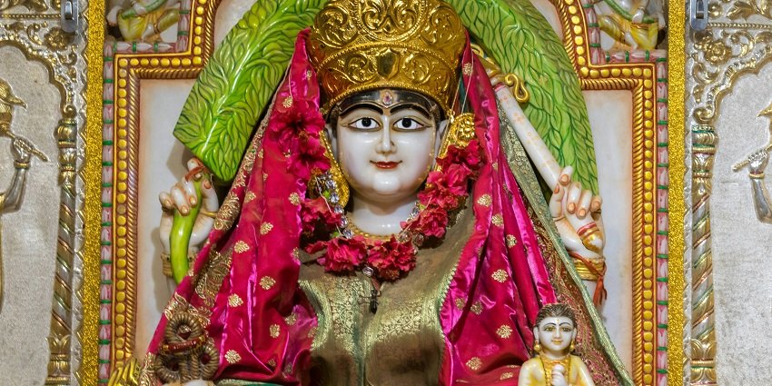A view of the Devi Mandir featuring the statue of God that is beautifully decorated.