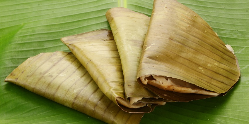 Kerala's traditional ela ada, a steamed rice cake wrapped in banana leaves.