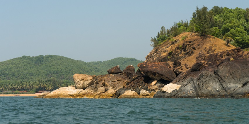 The magnificent stone formations and waves highlight the tranquil environment.