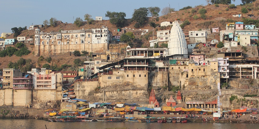 View of Omkar Mandhata Island from the river, one of the most exciting places to visit in Omkareshwar.