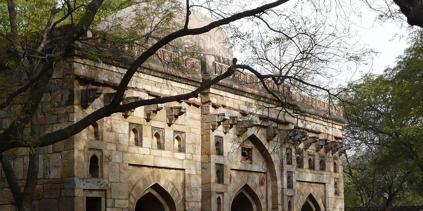 A picture of a mosque from the times of the 14th century taken from its nearby garden area