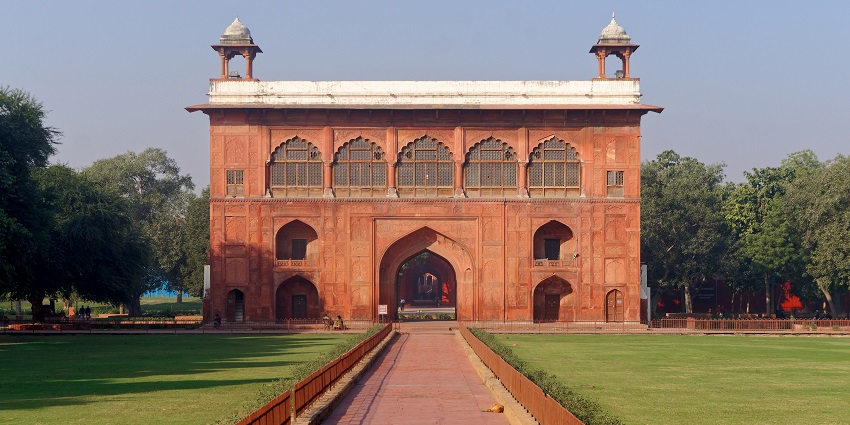 A picture of a smaller monument inside the Red Fort with a walkway leading towards it