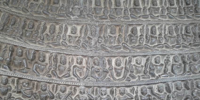 A close up view of the detailing done by sculpting figures all around the body.