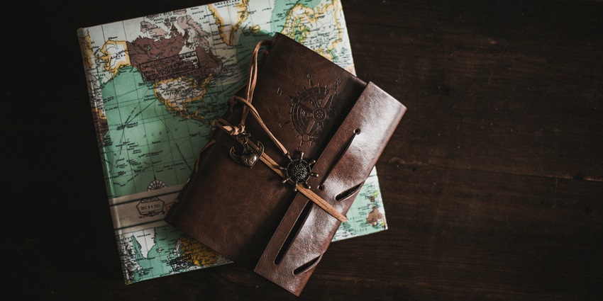 An image of a diary and map with various items, for a visit to the forts in Kutch, Gujarat.