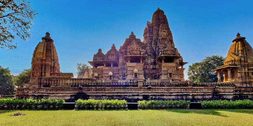 A photo of Lakshmana temple with intricate carvings and sculptures depicting the harmonious relationship of Jains and Hindus.