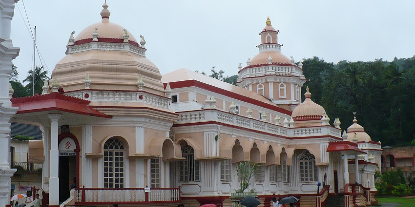 The intricate architecture of the temple with arched windows and dome shaped tops