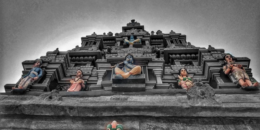 One of the ancient temples in India, with a statue of Lord Krishna in between.