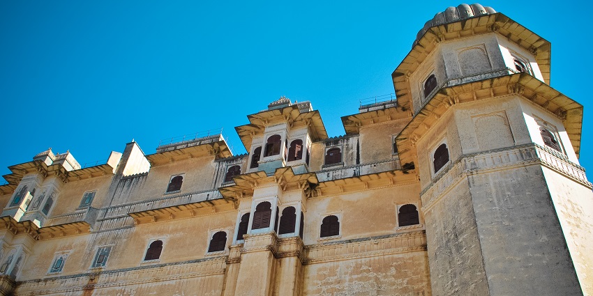 View of a tall fort wall, reflecting the detailed architecture