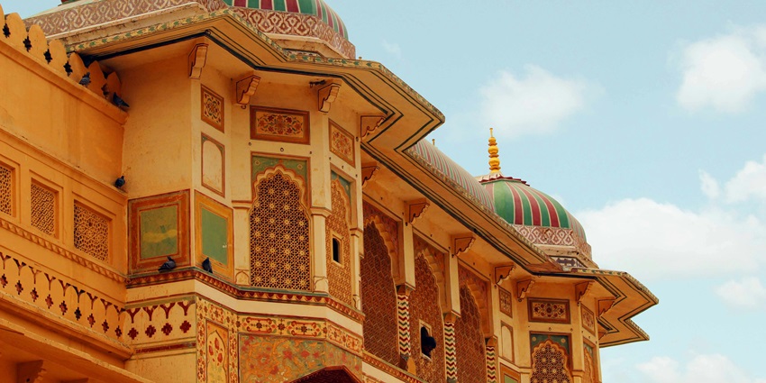 The image shows the Kanota Fort with intricate architectural details with ornate designs, and traditional patterns