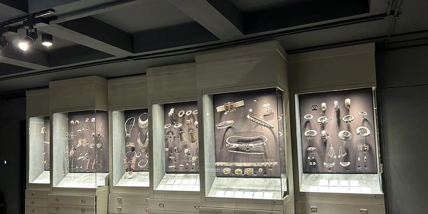 An interior view of the Amrapali Museum with ancient jewellery displayed in well-lit drawers.