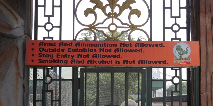 A bunch of cautions and tips written on a red board for the people visiting the park.