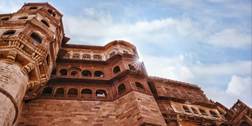 Low angle of the tall fort walls and windows against the bright blue sky