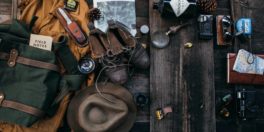 An image of all the travel things necessary for travelling and creating memories.