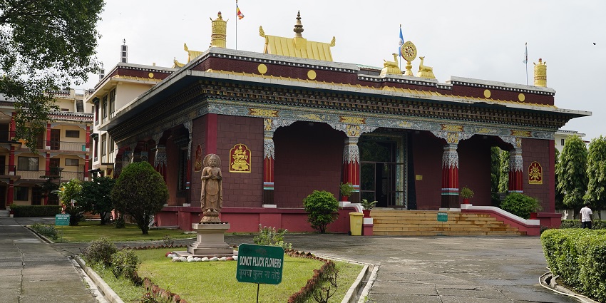 Detailed figures and patterns with rich artistry of Buddhist architecture and visitors