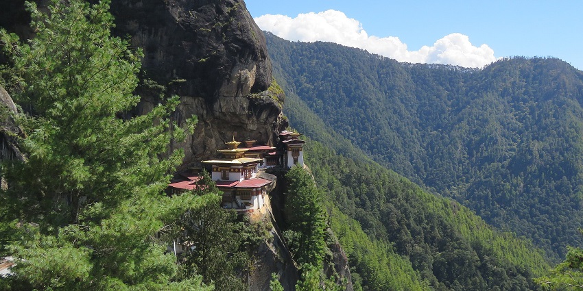 View of Taktsang Monastery from the trekking path with the majestic Himalayan backdrop.