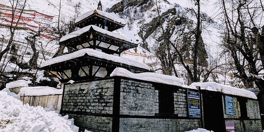 Muktinath Temple in Nepal, a sacred site for Hindus and Buddhists, surrounded by mountains.