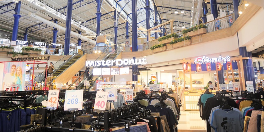A mesmerising view of the ground floor of a mall with clothing items displayed openly.