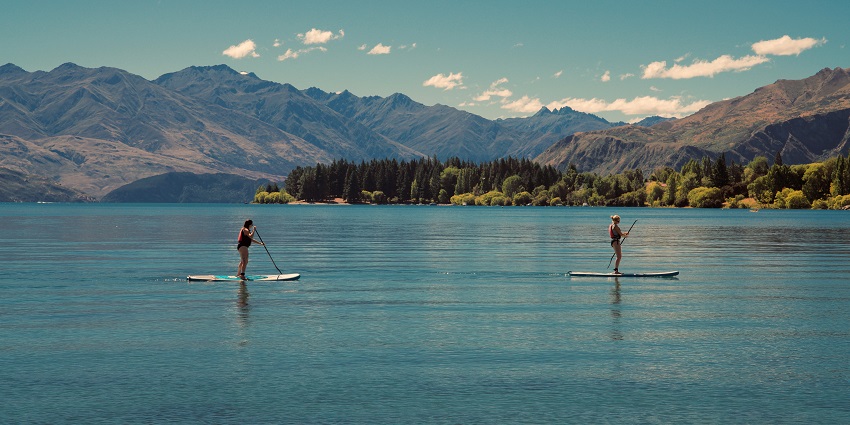 Paddleboarding amidst the white sand beaches with the tall palm trees make it a rewarding experience for tourists.