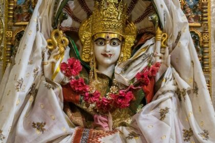 Parshvanath Devi temple - Close-up of a white and gold Maa Padmavati in traditional attire.