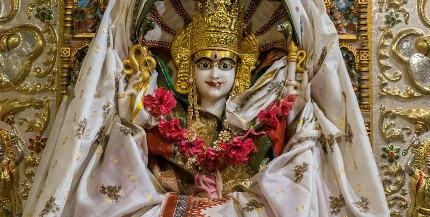 Parshvanath Devi temple - Close-up of a white and gold Maa Padmavati in traditional attire.