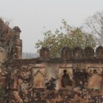 View of the Palamu fort's terrace, surrounded by lush tall trees