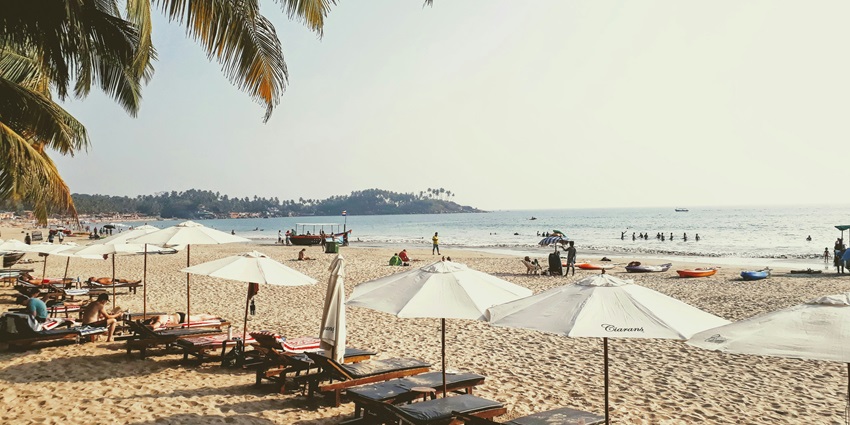 A view of people on Palolem Beach, one of the top places to visit in Goa for couples.
