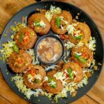 A glimpse of a plate beautifully decorated with pani puris, an appetising delicacy.