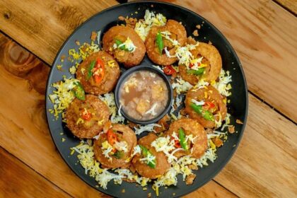 A glimpse of a plate beautifully decorated with pani puris, an appetising delicacy.