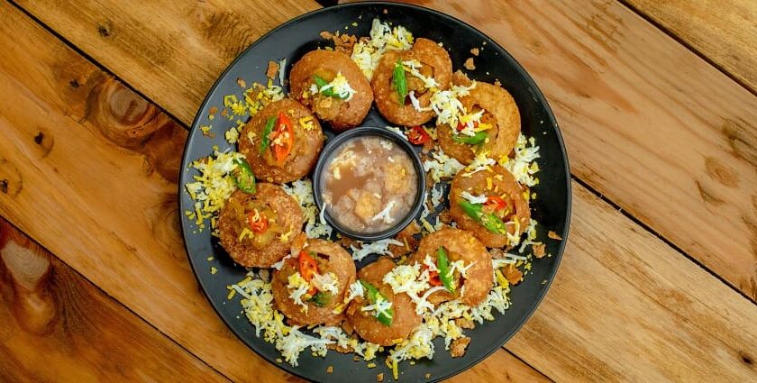 A glimpse of a plate beautifully decorated with pani puris, an appetising delicacy.