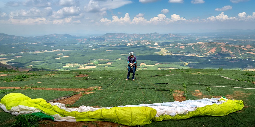 A colourful parachute lies on the ground, ready for the next adventure in the sky.