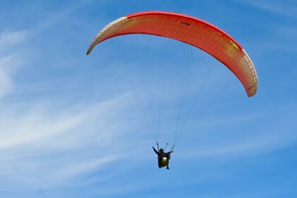 A person paragliding through the beauty of the town and moist mist - paragliding in Gujarat