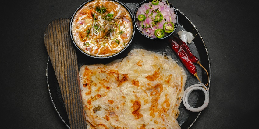 Delicious Lacha Indian Paratha, showcasing its flaky layers and golden colour