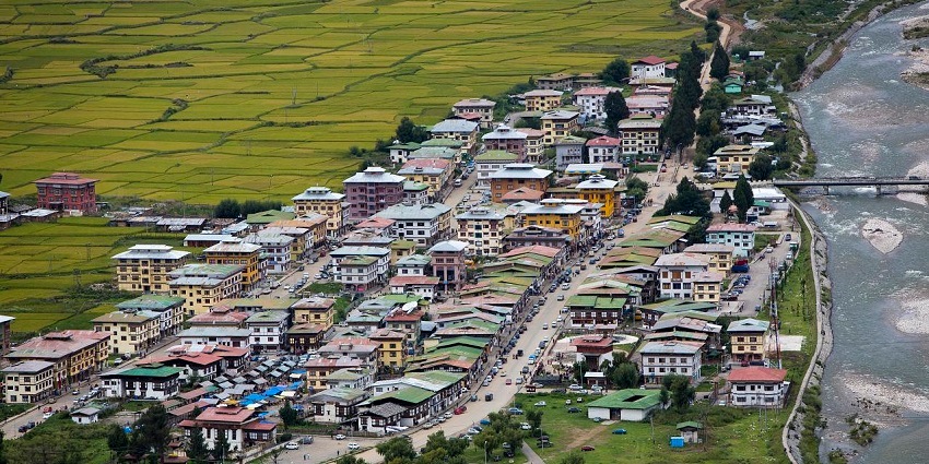 Good places to visit in Bhutan in May can be seen in this image of Paro, highlighting traditional architecture and natural beauty.