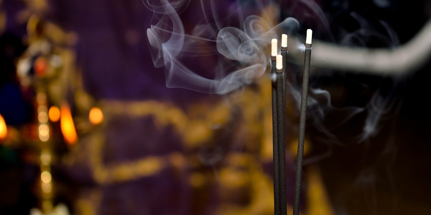 A glimpse of incense sticks being lit inside a temple for pooja and other rituals.