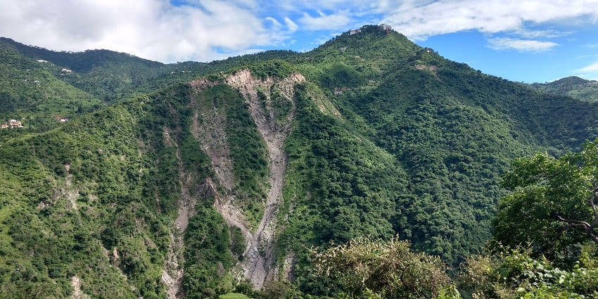 Image of Parwanoo hills with lush greenery under clear blue sky and tranquil environment