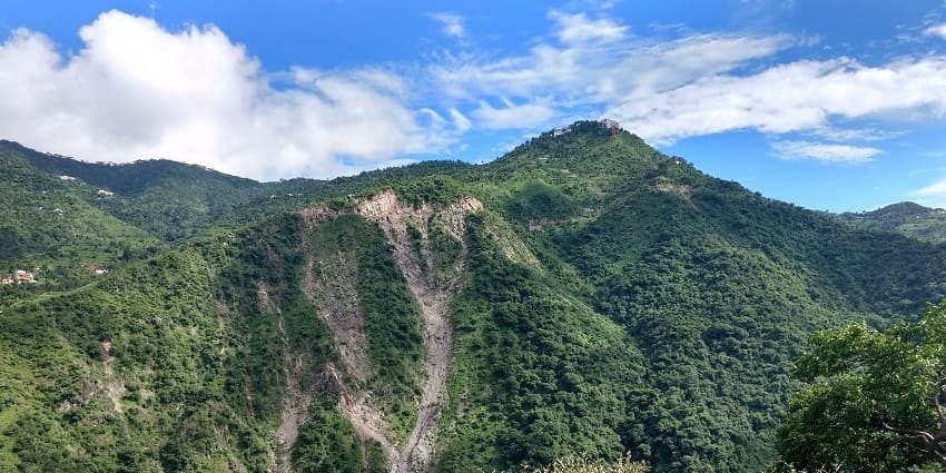 Scenic view of Parwanoo hills, showcasing lush greenery and majestic mountain peaks.