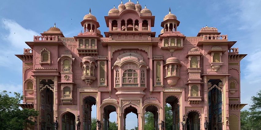 A vibrant gateway adorned with intricate murals, leading to Asia’s largest circular park.