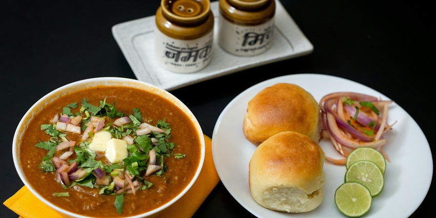 Pav Bhaji is an iconic street food in Rajkot served with some extra buttery goodness.