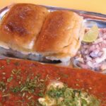 Mouth-watering pao bhaji, served with onions and lemon, one of the best foods in Jamnagar