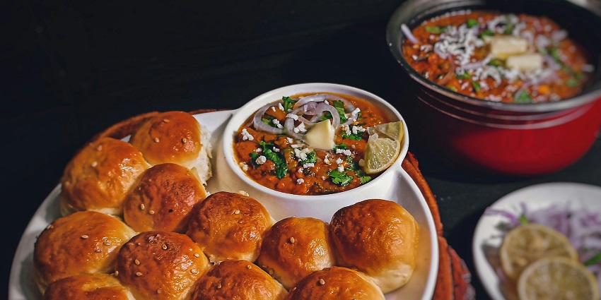 An image of delicious Pav Bhaji served with spicy curry with buttered pav, try at Srinath.