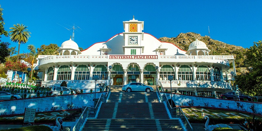 A front view of the Brahma Kumaris Om Shanti Bhawan (Universal Peace Hall) in Mount Abu.