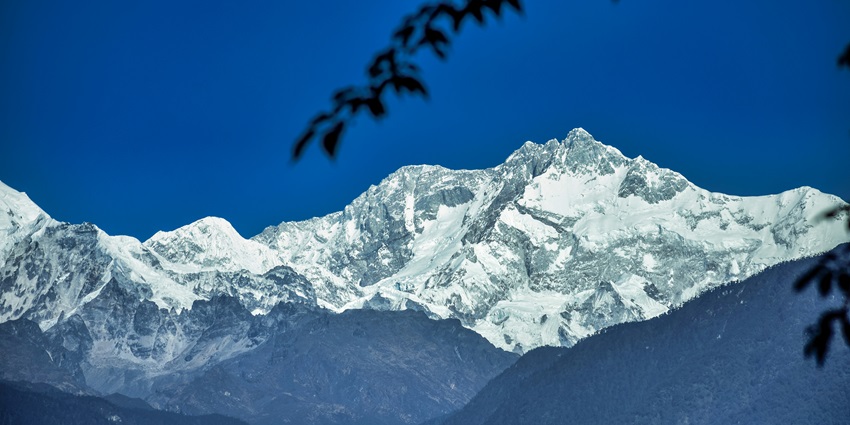 A breathtaking snow-capped view of majestic mountains in Pelling in Sikkim.