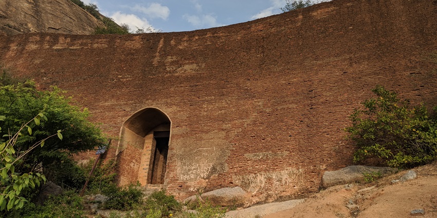 A view of the rustic walls of Penukonda Fort, a tourist hotspot near Anantapur Waterfalls.