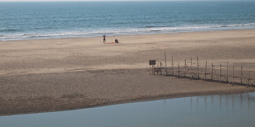 Mandrem Beach behind the Mandrem River in North Goa is a quiet and peaceful white sand beach
