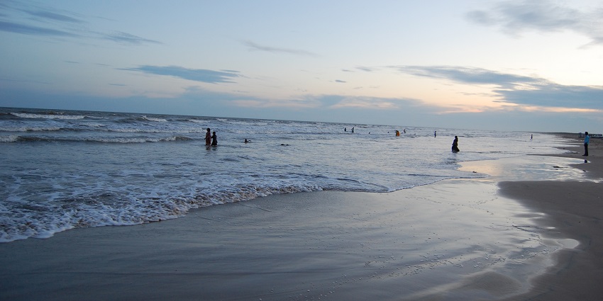  A picture of a beach, one of the best places to visit in Bhimavaram, taken during the time of sunset