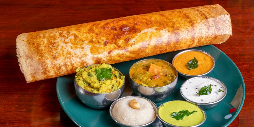 A glimpse of Pesarattu served with chutneys, one of the best foods in Rajahmundry.