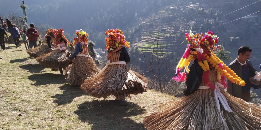 Folk dancers in colourful dresses perform traditional dance in Himachal harvest festival.